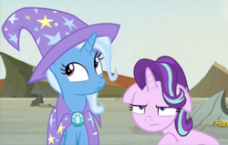 Size: 783x498 | Tagged: safe, screencap, starlight glimmer, trixie, pony, g4, to change a changeling, cape, clothes, cropped, discovery family logo, floppy ears, starlight glimmer is not amused, trixie's cape, unamused