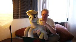 Size: 640x360 | Tagged: safe, derpy hooves, human, g4, irl, irl human, photo, plushie