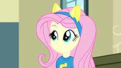 Size: 1280x720 | Tagged: safe, screencap, fluttershy, equestria girls, g4, my little pony equestria girls: summertime shorts, steps of pep, canterlot high, clothes, female, pony ears, school spirit, solo, wondercolts