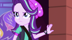 Size: 1280x718 | Tagged: safe, screencap, starlight glimmer, equestria girls, equestria girls specials, g4, my little pony equestria girls: mirror magic, beanie, clothes, determined, female, hat, shoulder bag, solo, vest, watch