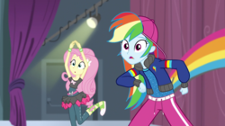 Size: 1280x718 | Tagged: safe, screencap, fluttershy, rainbow dash, equestria girls, equestria girls specials, g4, my little pony equestria girls: dance magic, backwards ballcap, baseball cap, cap, clothes, female, hat, hip hop, open mouth, outfit, pants, rapper dash, surprised