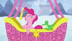 Size: 1280x720 | Tagged: safe, screencap, gummy, pinkie pie, pony, g4, not asking for trouble, ambassador badge, happy, hot air balloon, snow, twinkling balloon