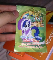 Size: 720x815 | Tagged: safe, rarity, human, pony, unicorn, g4, hearth's warming eve (episode), bootleg, cape, clothes, eid al-fitr, envelope, female, indonesia, irl, islam, mosque, photo, rainbow, solo
