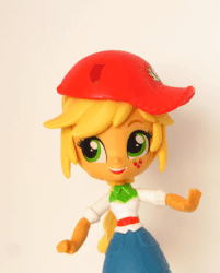 Size: 437x543 | Tagged: safe, artist:whatthehell!?, edit, applejack, equestria girls, g4, animated, baseball cap, cap, clothes, dancing, denim skirt, doll, equestria girls minis, eqventures of the minis, female, hat, irl, photo, skirt, solo, stop motion, toy