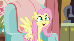 Size: 1280x720 | Tagged: safe, screencap, fluttershy, pegasus, pony, discordant harmony, g4, couch, cute, female, mare, open mouth, shyabetes, sitting, smiling, solo, spread wings, weapons-grade cute, wings
