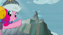 Size: 1343x758 | Tagged: safe, screencap, pinkie pie, earth pony, pony, g4, the lost treasure of griffonstone, abysmal abyss, female, griffonstone, hat, looking back, low angle, mare, mountain, peak, pointing, raised hoof, smiling, solo