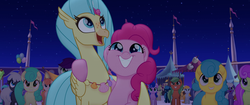 Size: 1920x804 | Tagged: safe, screencap, bell perin, pinkie pie, plum blossom (g4), princess skystar, classical hippogriff, earth pony, hippogriff, pony, g4, my little pony: the movie, background pony, female, flower, hug, jewelry, male, mare, necklace, rainbow (song), seashell, seashell necklace, smiling, stallion, unnamed character, unnamed pony, winghug