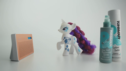 Size: 1366x768 | Tagged: safe, rarity, pony, unicorn, g4, brushable, commercial, cutie mark magic, electronic toy, glamor glow rarity, hair spray, irl, live action, looking up, photo, pop culture, radio, solo, toy, very, very (uk store)