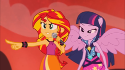 Size: 1366x768 | Tagged: safe, screencap, sunset shimmer, twilight sparkle, equestria girls, g4, my little pony equestria girls: rainbow rocks, >:), >:d, grin, happy, lidded eyes, microphone, pointing, ponied up, smiling, smirk, spread wings, welcome to the show, wings