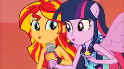 Size: 1366x768 | Tagged: safe, screencap, sunset shimmer, twilight sparkle, equestria girls, g4, my little pony equestria girls: rainbow rocks, 8^y, faic, happy, microphone, ooh, ponied up, smiling, spread wings, wings