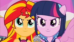 Size: 1366x768 | Tagged: safe, screencap, sunset shimmer, twilight sparkle, equestria girls, g4, my little pony equestria girls: rainbow rocks, >:), happy, microphone, ponied up, rebecca shoichet, smiling, smirk, voice actor joke, welcome to the show