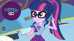 Size: 630x354 | Tagged: safe, sci-twi, twilight sparkle, equestria girls, equestria girls series, g4, cellphone, discovery family go, female, phone, pointing, smartphone, solo