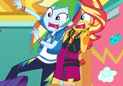 Size: 549x383 | Tagged: safe, screencap, rainbow dash, sunset shimmer, equestria girls, equestria girls series, g4, rollercoaster of friendship, clothes, cropped, female, geode of empathy, geode of super speed, hoodie, jacket, leather, leather jacket, magical geodes, pants, photo booth, photo booth (song), skirt, vest