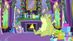 Size: 1920x1080 | Tagged: safe, screencap, sludge (g4), spike, dragon, father knows beast, g4, doll, duo, fake hearth's warming eve, fireplace, hearth's warming doll, hearth's warming eve, male, present, toy, winged spike, wings