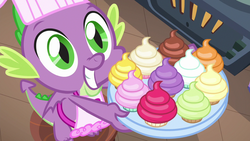 Size: 1280x720 | Tagged: safe, screencap, spike, dragon, father knows beast, g4, apron, clothes, cupcake, cute, food, hopeful, looking up, male, naked apron, smiling, solo, spikabetes, tray
