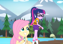 Size: 1022x720 | Tagged: safe, screencap, fluttershy, sci-twi, twilight sparkle, equestria girls, g4, my little pony equestria girls: legend of everfree, camp everfree outfits, clothes, cropped, female, glasses, ponytail, shorts, smiling