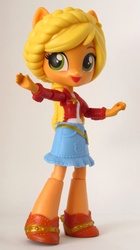 Size: 1101x1970 | Tagged: safe, artist:whatthehell!?, applejack, equestria girls, g4, clothes, doll, equestria girls minis, eqventures of the minis, irl, merchandise, photo, ponied up, shoes, skirt, theme park, toy