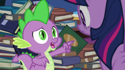 Size: 1280x720 | Tagged: safe, screencap, spike, twilight sparkle, alicorn, pony, father knows beast, g4, book, library, pointing, twilight sparkle (alicorn), twilight's castle, twilight's castle library