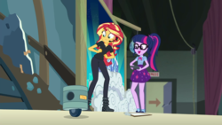 Size: 1280x720 | Tagged: safe, screencap, sci-twi, sunset shimmer, twilight sparkle, human, robot, all the world's off stage, all the world's off stage: twilight sparkle, equestria girls, g4, my little pony equestria girls: better together, clipboard, clothes, director shimmer, duo, female, geode of telekinesis, glasses, headset, high heels, magical geodes, ponytail, school play, shoes, skirt