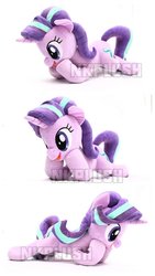 Size: 1151x2048 | Tagged: safe, artist:nekokevin, starlight glimmer, pony, unicorn, series:nekokevin's glimmy, g4, female, irl, lying down, mare, open mouth, photo, plushie, raised hoof, simple background, smiling, triality, watermark, white background