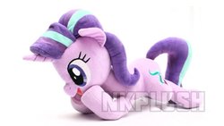 Size: 1280x720 | Tagged: safe, alternate version, artist:nekokevin, starlight glimmer, pony, unicorn, series:nekokevin's glimmy, g4, female, irl, lying down, mare, obtrusive watermark, open mouth, photo, plushie, raised hoof, simple background, smiling, solo, watermark, white background