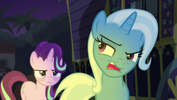 Size: 1280x720 | Tagged: safe, screencap, starlight glimmer, trixie, g4, road to friendship, annoyed, bags under eyes, light, night, raised eyebrow, trixie's wagon, wagon