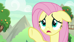Size: 1280x720 | Tagged: safe, screencap, fluttershy, pegasus, pony, g4, sounds of silence, female, floppy ears, mare, open mouth, raised hoof, solo