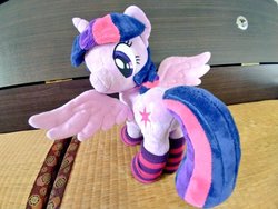 Size: 1024x768 | Tagged: safe, artist:nekokevin, twilight sparkle, alicorn, pony, g4, 4de, clothes, female, irl, looking at you, looking back, mare, photo, plushie, smiling, socks, solo, spread wings, striped socks, twilight sparkle (alicorn), wings