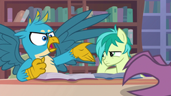 Size: 1280x720 | Tagged: safe, screencap, gallus, sandbar, silverstream, earth pony, griffon, pony, g4, what lies beneath, annoyed, book, bookshelf, chest fluff, claws, ladder, library, male, offscreen character, tapping, teenager