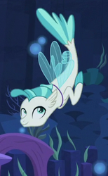 Size: 268x436 | Tagged: safe, screencap, terramar, seapony (g4), g4, surf and/or turf, blue eyes, blue mane, blue tail, bubble, coral, cropped, dorsal fin, fin, fin wings, fins, fish tail, floppy ears, flowing mane, flowing tail, happy, jewelry, male, necklace, ocean, seaquestria, seaweed, smiling, solo, swimming, tail, underwater, water, wings