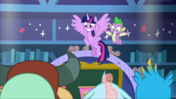 Size: 1669x939 | Tagged: safe, screencap, gallus, ocellus, spike, twilight sparkle, yona, alicorn, dragon, pony, a matter of principals, g4, classroom, duo focus, female, flying, happy, hooves on hips, male, school of friendship, smiling, twilight sparkle (alicorn), winged spike, wings