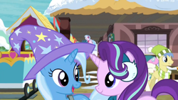 Size: 1920x1080 | Tagged: safe, screencap, goldengrape, silverstream, sir colton vines iii, starlight glimmer, trixie, earth pony, pony, unicorn, g4, my little pony best gift ever, best friends, clothes, cute, duo focus, earmuffs, female, hat, looking at each other, male, mare, stallion, train station, trixie's hat, winter outfit, wizard hat