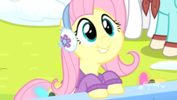 Size: 1920x1080 | Tagged: safe, screencap, fluttershy, pegasus, pony, g4, my little pony best gift ever, clothes, cute, earmuffs, female, fluttershy's purple sweater, happy, mare, scarf, shyabetes, smiling, snow, solo focus, sweater, sweatershy, winter outfit