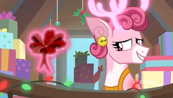Size: 1920x1080 | Tagged: safe, screencap, bori the reindeer, deer, reindeer, g4, my little pony best gift ever, bell, bow, christmas, christmas lights, deer magic, discovery family logo, doe, ear piercing, earring, female, glowing antlers, grove of the gift givers, holiday, holly, jewelry, levitation, magic, magic aura, piercing, present, smiling, telekinesis