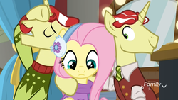 Size: 1920x1080 | Tagged: safe, screencap, flam, flim, fluttershy, pegasus, pony, unicorn, g4, my little pony best gift ever, christmas sweater, clothes, cute, discovery family logo, female, flim flam brothers, hug, male, mare, melodramatic, necktie, scarf, shirt, shyabetes, stallion, sweater, trio, vest, winter outfit