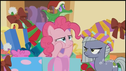 Size: 1280x720 | Tagged: safe, screencap, limestone pie, pinkie pie, alligator, earth pony, pony, best gift ever, g4, christmas, decoration, discovery family logo, female, hat, holiday, limestone pie is not amused, male, mare, santa hat, sisters, unamused