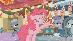Size: 1351x757 | Tagged: safe, screencap, limestone pie, marble pie, maud pie, pinkie pie, earth pony, pony, g4, my little pony best gift ever, bow, box, candy, candy cane, decoration, discovery family logo, eyes closed, female, food, lollipop, mare, pie sisters, raised hoof, siblings, sisters, sugarcube corner