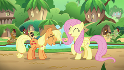 Size: 1280x720 | Tagged: safe, screencap, applejack, autumn afternoon, fern flare, fluttershy, forest fall, maple brown, pumpkin smoke, earth pony, kirin, pegasus, pony, g4, sounds of silence, background kirin, bucket, duo focus, eyes closed, female, fountain, kirin village, laughing, male, mare, raised hoof, sitting, water
