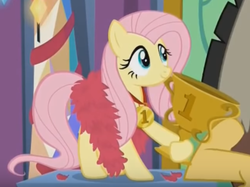 Size: 684x512 | Tagged: safe, screencap, discord, fluttershy, pegasus, pony, g4, my little pony best gift ever, cropped, cute, feather boa, female, mare, medal, offscreen character, pedestal, shyabetes, smiling, solo focus, trophy