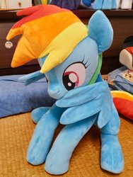 Size: 768x1024 | Tagged: safe, artist:nekokevin, rainbow dash, pegasus, pony, g4, behaving like a bird, cute, dashabetes, female, irl, mare, nom, open mouth, photo, plushie, preening, sitting, smiling, solo, spread wings, wings
