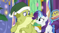 Size: 1920x1080 | Tagged: safe, screencap, rarity, sludge (g4), dragon, pony, unicorn, father knows beast, g4, christmas, christmas decoration, christmas ornament, decoration, discovery family logo, female, generosity, glowing horn, hat, hearth's warming, holiday, horn, levitation, magic, magic aura, male, mare, present, santa hat, telekinesis, twilight's castle