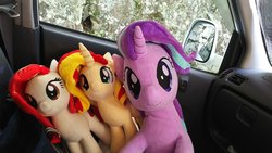Size: 1200x675 | Tagged: safe, artist:nekokevin, starlight glimmer, sunset shimmer, oc, oc:poniko, earth pony, pony, unicorn, series:nekokevin's glimmy, g4, car, car seat, female, irl, looking at you, mare, photo, plushie, sitting, size difference, smiling
