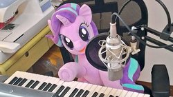 Size: 1024x577 | Tagged: safe, artist:nekokevin, starlight glimmer, pony, unicorn, series:nekokevin's glimmy, g4, chair, female, irl, keyboard, looking at you, mare, microphone, musical instrument, open mouth, photo, plushie, sewing machine, sitting, smiling, solo, underhoof