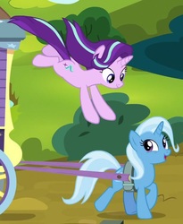 Size: 610x744 | Tagged: safe, screencap, starlight glimmer, trixie, pony, unicorn, g4, road to friendship, cropped, cute, jumping, trixie's wagon