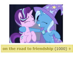 Size: 282x224 | Tagged: safe, edit, edited screencap, screencap, starlight glimmer, trixie, pony, unicorn, derpibooru, g4, road to friendship, 1000, bipedal, cape, clothes, duo, eyes closed, get, hat, hug, meta, tags, trixie's cape, trixie's hat