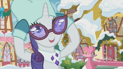 Size: 842x474 | Tagged: safe, screencap, rarity, pony, g4, my little pony best gift ever, clothes, female, glasses, house, houses, mittens, ponyville, snow, solo, winter, winter outfit