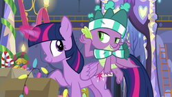 Size: 1280x720 | Tagged: safe, screencap, spike, twilight sparkle, alicorn, dragon, pony, g4, my little pony best gift ever, christmas, christmas lights, clothes, duo, female, glowing horn, hat, holiday, horn, magic, male, mare, scarf, striped scarf, stupid sexy spike, telekinesis, twilight sparkle (alicorn), winged spike, wings, winter outfit
