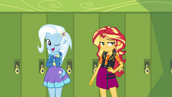 Size: 1920x1080 | Tagged: safe, screencap, sunset shimmer, trixie, equestria girls, equestria girls series, forgotten friendship, g4, barrette, canterlot high, clothes, cute, diatrixes, duo, geode of empathy, hallway, hoodie, leather vest, lidded eyes, lockers, looking at you, magical geodes, one eye closed, open mouth, raised eyebrow, skirt, smiling, smirk, wink