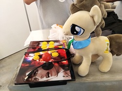 Size: 4032x3016 | Tagged: safe, photographer:horsesplease, doctor whooves, time turner, earth pony, pony, g4, console, irl, king of fighters, malaysia, photo, plushie, retro, solo, the friendship express