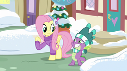 Size: 1280x720 | Tagged: safe, screencap, fluttershy, spike, dragon, pegasus, pony, best gift ever, g4, clothes, duo, earmuffs, female, fluttershy's purple sweater, hat, male, mare, scarf, snow, striped scarf, sweater, sweatershy, winter, winter outfit